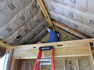 Tim is busy finishing up the insulation