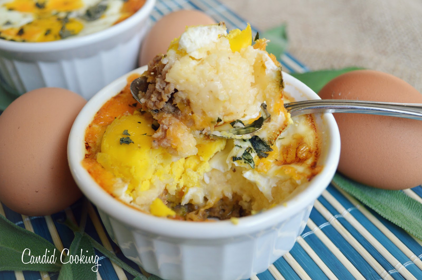 Candid Cooking Baked Eggs with Grits and Sausage