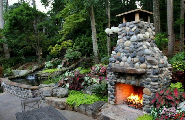 covered outdoor living spaces with fireplace