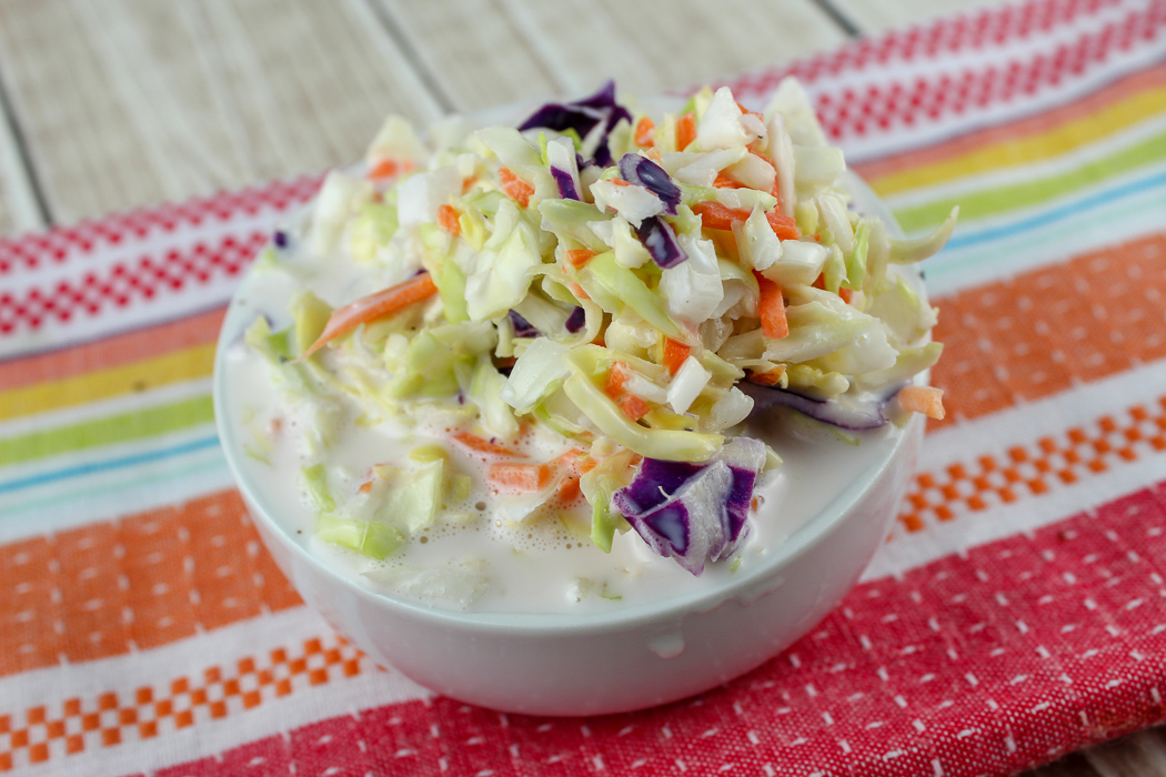 KFC Coleslaw has always been my favorite restaurant side dish! It's got a creamy dressing that is a little sweet and very simple. With spring here, I have been craving coleslaw and made this simple copycat KFC Coleslaw recipe in minutes!