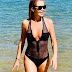 Amanda Holden shows off her abs in see-through swimsuit as she walks out the sea on Portugal beach holiday