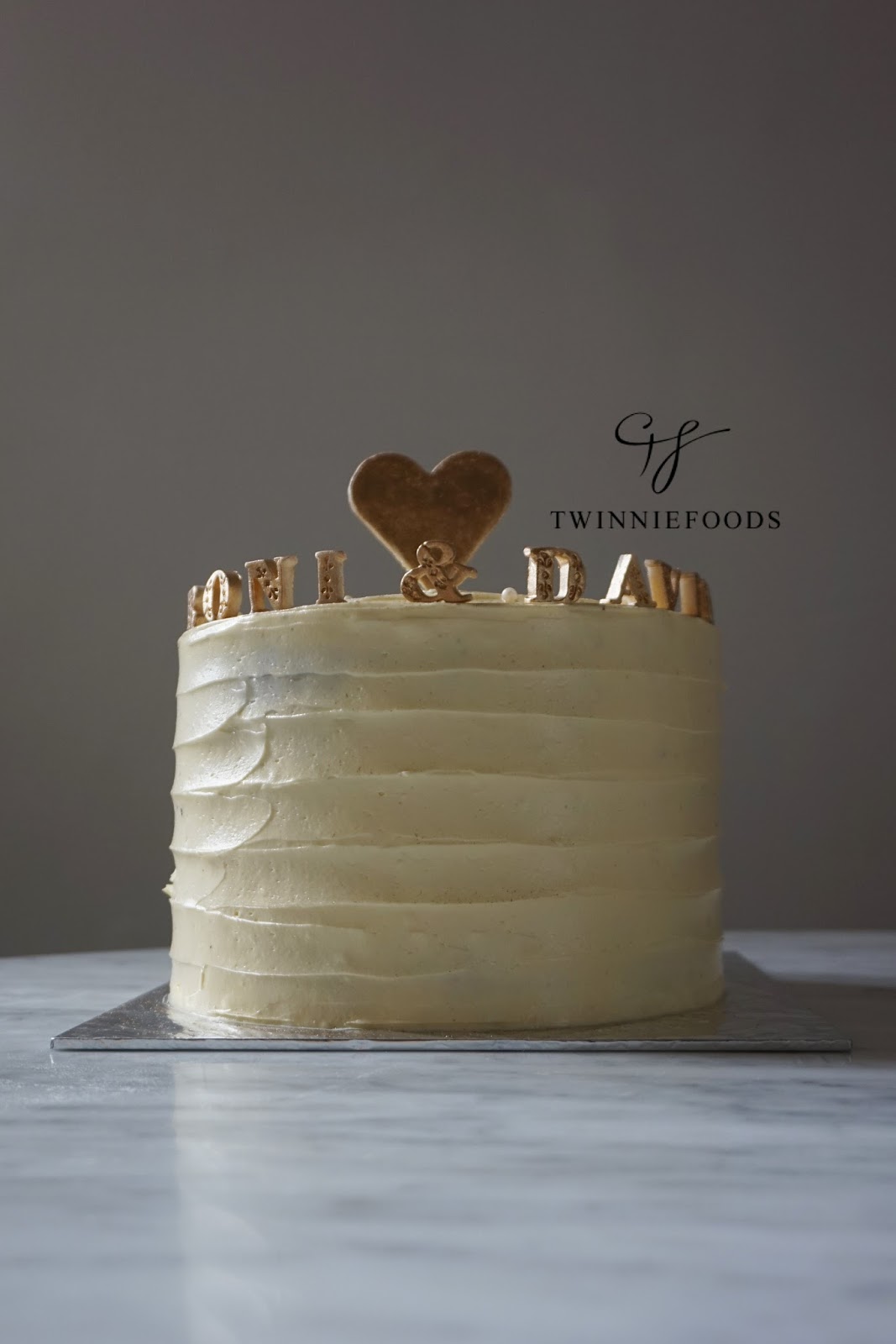 Minimalistic white and gold Wedding Anniversary cake TwinnieFoods