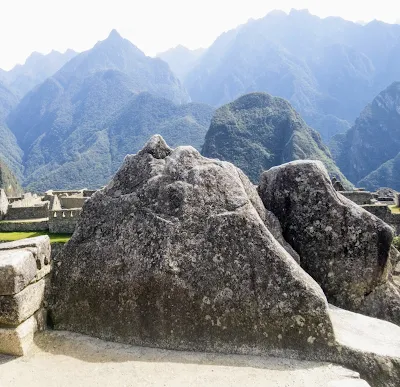 Images of Machu Picchu: Ceremonial rocks that resemble the Andes in the distance at Machu Picchu