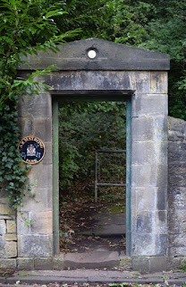 An elaborate stone gateway into Armstrong Park from Ouseburn Road