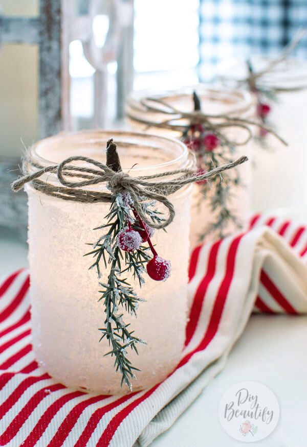 frosted Christmas luminaries in mason jars