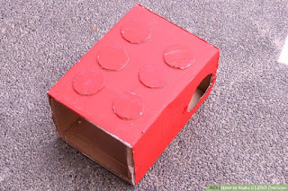    LEGO Brick Kostum 1 Dapatkan kotak. Kotak harus cukup tinggi untuk menutupi seluruh tubuh dari pemakainya dimaksudkan dan sekitar bahu-lebar. Jangan mendapatkan kotak yang memanjang di bawah lutut atau masa lalu siku, baik sebagai sifat akan membuat tidak mungkin untuk bergerak di sekitar. Idealnya, kotak akan berakhir tepat di atas pinggul dan pada garis bahu sehingga pemakainya masih akan memiliki kesulitan bergerak di sekitar. Kedalaman kotak harus tidak lebih besar dari lebar, tetapi Anda dapat memilih untuk kotak dengan kedalaman lebih dangkal untuk membuatnya lebih mudah untuk bergerak di sekitar. Minimal, kotak hanya perlu cukup dalam bagi pemakainya dimaksudkan untuk masuk ke dalam.  2Hapus bagian bawah kotak kardus besar               Gunakan kotak cutter atau sepasang gunting tajam untuk memotong kardus itu di halus, bahkan line.  Tape up sisi lain dari kotak untuk mencegah tutup kardus dari datang longgar      3 Beri lubang untuk lengan dan kepala. Lubang untuk kepala akan perlu berada di pusat atas sedangkan lubang untuk lengan akan perlu sepanjang sisi dan menuju ke atas. Gunakan kotak cutter atau sepasang gunting tajam untuk memotong lingkaran untuk lengan dan kepala.    Mulailah dengan kepala. Baik mengukur ruang yang diperlukan untuk kepala atau mengukur diameter kepala pemakainya dengan penggaris atau pita pengukur. Memotong lubang untuk kepala sebagai dekat ke tengah atas mungkin.    Menyelinap kotak lebih pemakainya sebelum memotong lubang lengan. Jarak yang tepat dari atas kotak di atas lubang lengan dapat bervariasi tergantung pada individu mengenakan kostum, dan mengukur dengan mata setelah tergelincir kotak di adalah cara terbaik untuk menentukan di mana lubang lengan harus pergi . Biasanya, ini akan menjadi sekitar 2-3 inci (5-7,6 cm) di bawah bagian atas kotak, sepanjang sisi. Setiap lubang perlu setidaknya selebar bagian terluas dari lengan pemakainya.        4 Cat Lapisan bawah putih. Tutup bagian atas dan semua sisi kotak dengan cat semprot putih atau cat kerajinan akrilik putih. Cat putih menciptakan "batu tulis kosong" macam, sehingga memudahkan warna akhir untuk menunjukkan secara akurat tanpa berwarna dengan warna karton.    Menggunakan non-glossy, cat matte. Anda harus menggunakan jenis cat yang cat lain akan menempel, membuat matte cat pilihan yang jauh lebih baik daripada cat glossy.  5  Cat Mantel Warna. Gunakan cat semprot atau cat kerajinan untuk menutupi kotak dengan warna dasar. Merah adalah warna yang paling klasik untuk batu bata LEGO, tetapi Anda juga bisa melukis kotak biru atau kuning. Beberapa warna yang ide yang sangat baik jika Anda memiliki beberapa orang yang menghadiri fungsi yang sama seperti batu bata LEGO. Memilih untuk terang, warna solid, seperti "pemadam kebakaran" merah.    Kedua mengkilap dan matte selesai bekerja untuk layer ini cat, tapi cat semprot adalah lebih baik untuk cat kerajinan akrilik sejak cat diterapkan oleh semprot cenderung halus dibandingkan cat diaplikasikan dengan kuas.   Anda mungkin perlu beberapa lapisan cat, tetapi menerapkan lapisan putih sebelum lapisan warna harus mengurangi jumlah total mantel warna.   Jangan khawatir tentang mendapatkan cat di dalam kotak saat Anda bekerja. Tidak ada bedanya apakah dalam kotak tetap bersih atau mendapat sengaja dilapisi cat.     6  Memotong lingkaran dari karton dicat. Anda akan butuh enam lingkaran bahkan, masing-masing dengan diameter yang mengukur sekitar 1/8 dari tinggi kotak. Lingkaran harus prima dengan cat putih dan dicat dengan warna yang sama dengan sisa kotak.   Sebuah ide yang baik adalah untuk menyelamatkan bagian bawah kardus Anda memotong dari kotak, memotong lingkaran itu, dan cat lingkaran menggunakan cat yang sama digunakan pada sisa kostum. kardus tambahan mungkin masih diperlukan, meskipun. Gunakan stensil, cookie cutter, atau kompas untuk menarik dan memotong lingkaran bulat sempurna.   Alih-alih menggunakan kardus, Anda juga bisa menggunakan putaran, bak makanan dangkal, seperti jenis memegang es krim atau margarin. Cat ini cat semprot menggunakan atau cat kerajinan disetujui untuk digunakan dengan plastik.   7 Melampirkan lingkaran ke kotak. Gunakan lem panas untuk mengamankan lingkaran karton ke depan kotak di dua kolom dengan tiga baris masing-masing.  Kolom dan baris semua harus dalam posisi lurus, bahkan dengan jarak antara masing-masing.  Anda mungkin perlu menggunakan penggaris atau pita pengukur untuk menandai dua kolom bahkan tiga bahkan baris. Lakukan ini dengan membagi lebar dari kotak menjadi tiga bagian bahkan dan tinggi menjadi empat bahkan bagian. Menggambar garis pensil tipis menandai off setiap bagian, dan menempatkan pusat satu lingkaran atas setiap persimpangan garis. Menghapus garis bila dilakukan.       8 Kenakan warna yang senada bawah kotak. Sebelum mengenakan kostum LEGO, pemakainya harus tergelincir pada kemeja lengan panjang dan celana panjang yang cocok dengan warna kotak. Nuansa tidak perlu sama persis, tapi mereka harus serupa. Misalnya, jika Anda dicat LEGO merah cerah, memakai pakaian dalam nuansa cerah lainnya merah.   Source