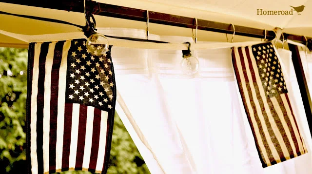 hanging American flags on a gazebo curtain