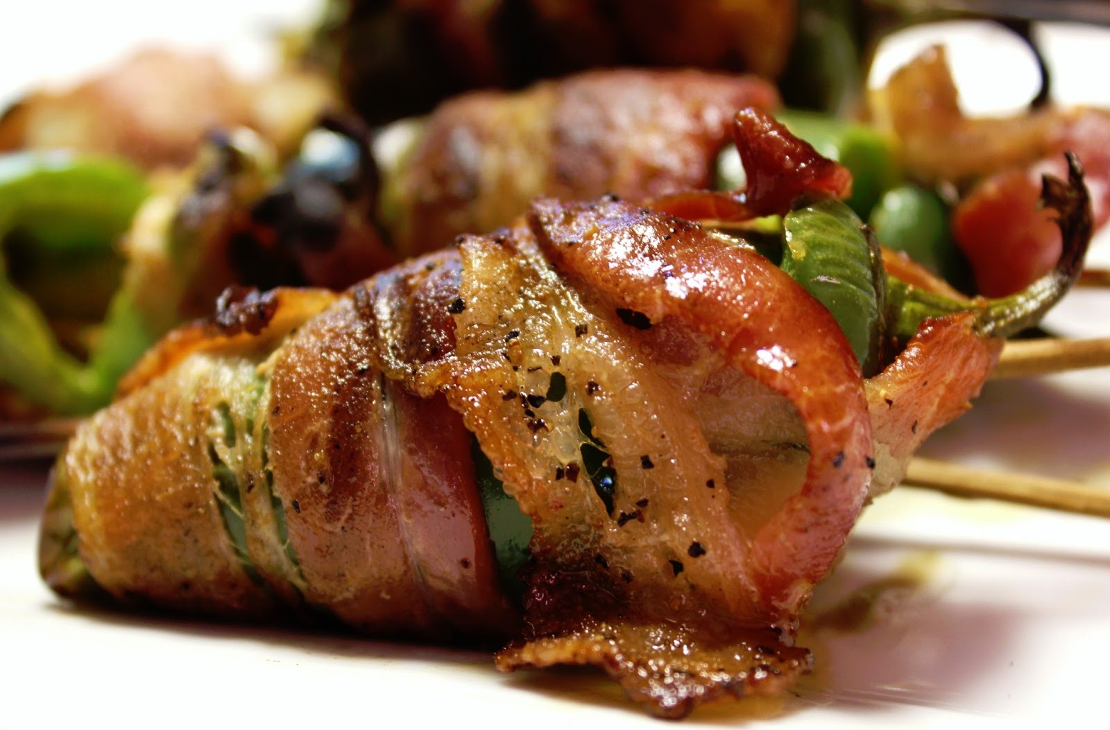Bacon wrapped cheese stuffed jalapenos on the grill!