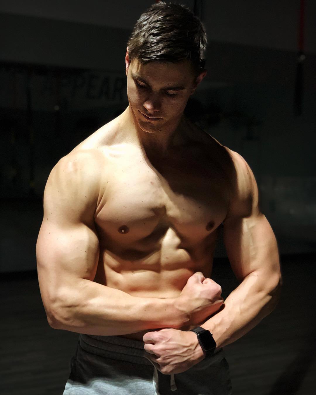 hot-young-shirtless-strong-guy-flexing-biceps-abs