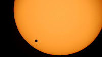 The planet Venus, black spot, is seen crossing the sun in 2004. On June 5, 2012, Venus will pass across the face of the sun, producing a silhouette that no one alive today will likely see again. (AP / Geert Vanden Wijngaert)