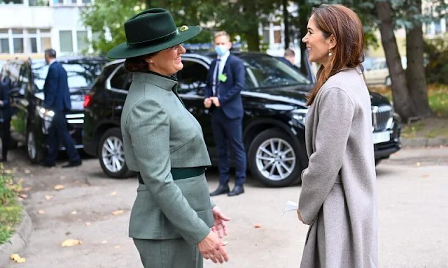 Crown Princess Mary a red contrast-stitch cady dress from Dolce & Gabbana, and double cashmere oslo coat from Joseph