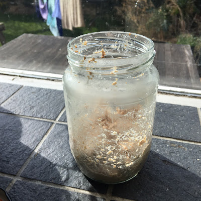 A jar containing a small amount of flour and water mixture