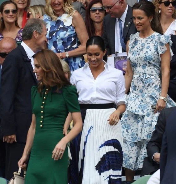 Kate Middleton wore a green midi dress by Dolce & Gabbana. Meghan Markle wore a print midi skirt by Hugo Boss