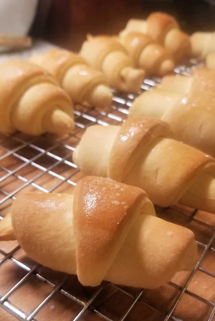 homemade crescent rolls cooling on wire rack