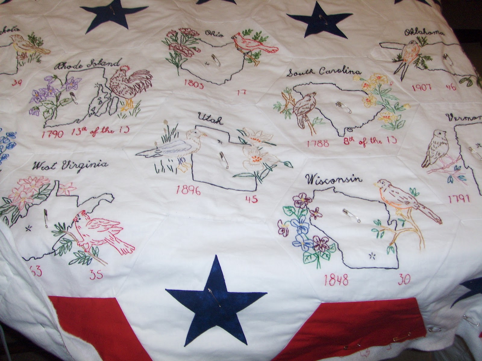 Under quilted covers quilting around embroidery