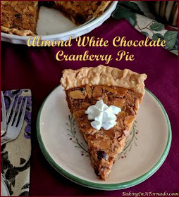 Almond White Chocolate Cranberry Pie. Warm seasonal flavors marry in this beautiful dessert, perfect for Thanksgiving or for Christmas. | Recipe developed by www.BakingInATornado.com | #recipe #dessert