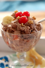 Chocolate Pudding dessert with cherries on top in a glass bowl