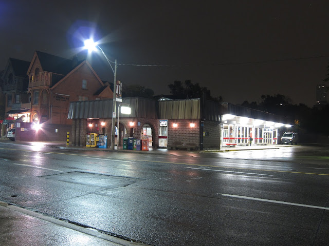 The main entrance for Spadina station, on the east side, a half block north of Bloor. The original entrance structure was set back from the road to allow for the Spadina Expressway. Is that supposed to be a mansard roof?