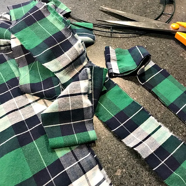 scissors and strips of green plaid