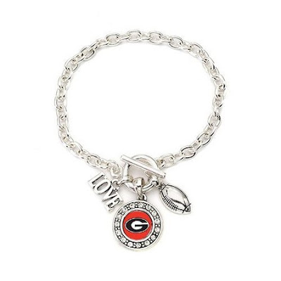 Go Bulldogs! This item is crafted from white metal with a sterling overlay. The bracelet includes a Georgia University pendant, football and a love charm. The bracelet measures 7 1/2 inches long.The total carat weight is 1/2 a carat