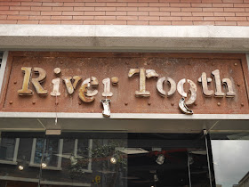 partially destroyed "River Tooth" sign in Zhuhai