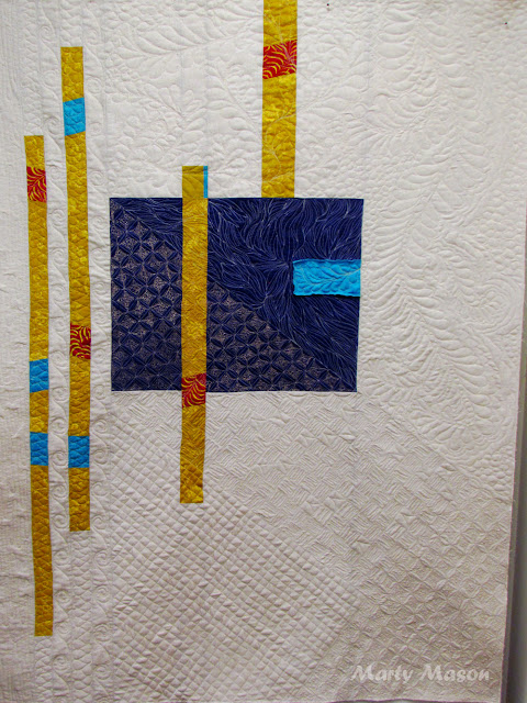 Only a few scraps remained, so I put them into a quilt:  improv style and set about random free-motion quilting