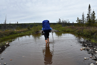 Sonya Richmond navigating flooded T'Railway Trail Newfoundland.