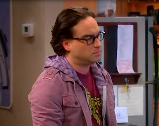 A screengrab of Leonard with his greasy-looking hair.