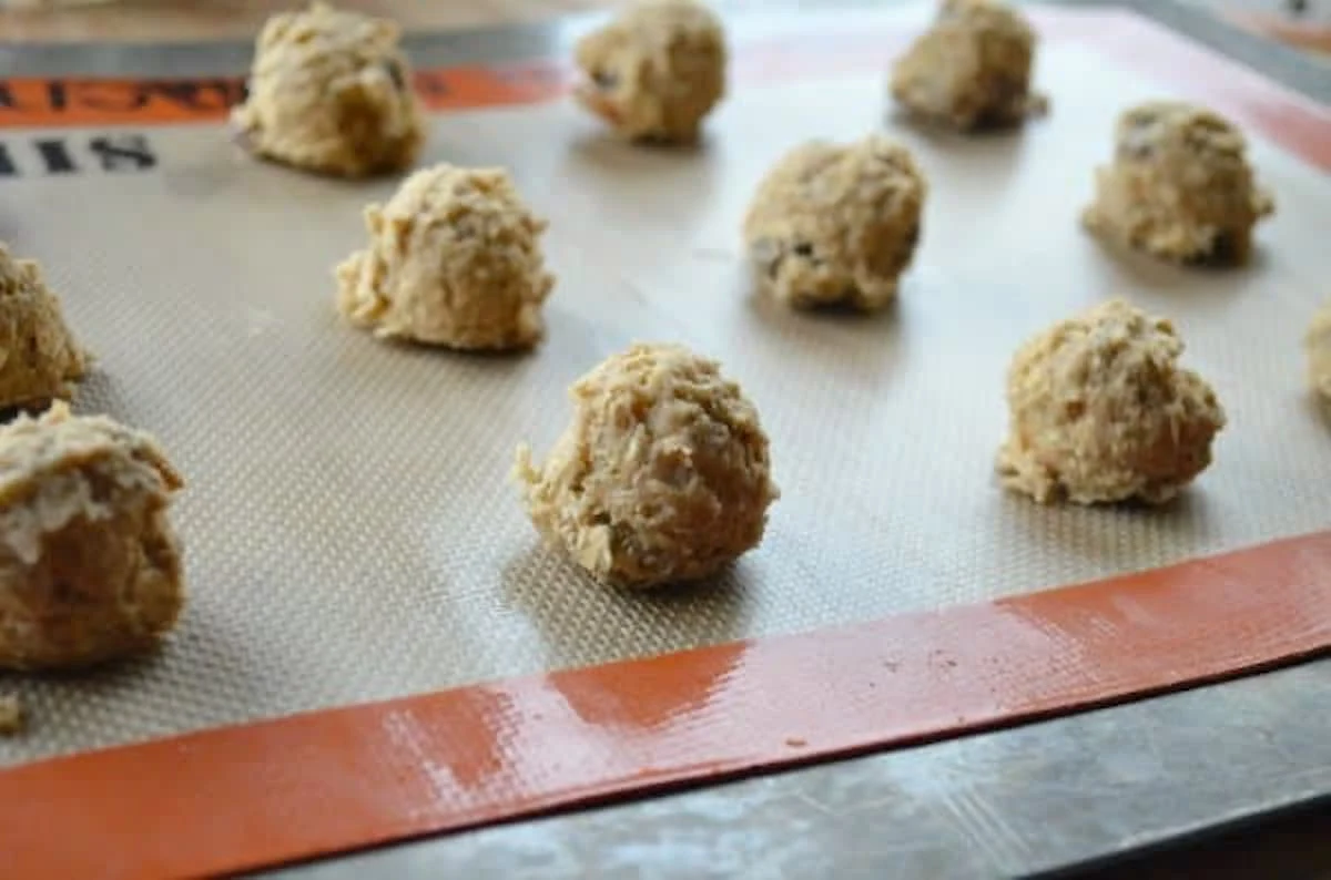 Chewy Spiced Oatmeal Raisin Cookie Dough dropped on Silpat Cookie Sheet.