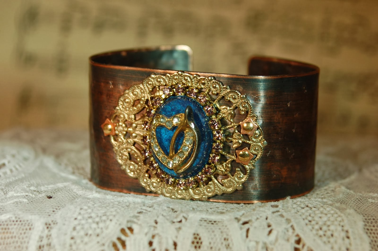 Copper bracelet with wishbone earring set in resin