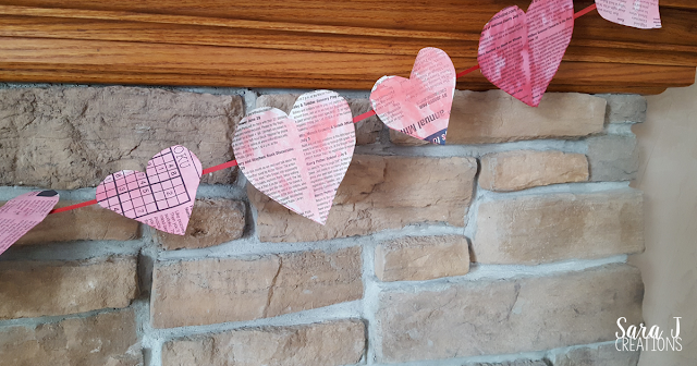 An easy newspaper heart banner craft. Perfect for #valentinesday or #february #crafts #hearts