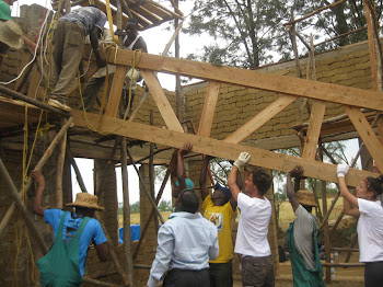 RWANDA: Helping the community build.