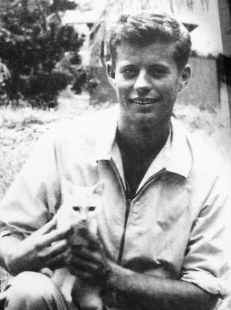 Early picture of John Kennedy holding a kitten when visiting the Solomon Islands in 1943