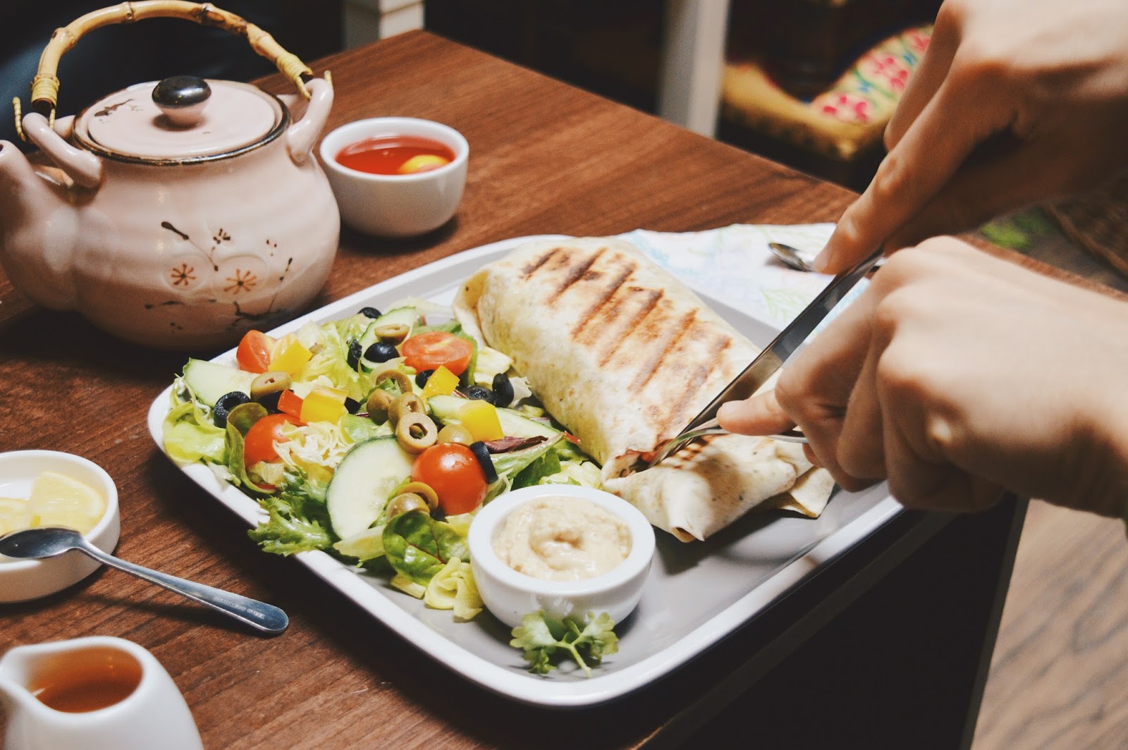 vegan food on plate and teapot