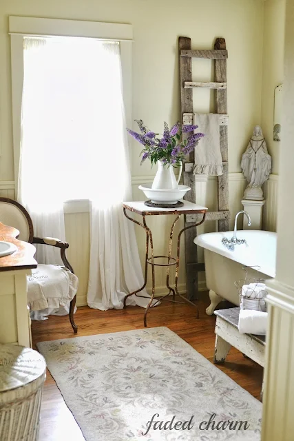 Reclaimed barnwood ladder / A beautifully reclaimed bathroom tour by Faded Charm, featured on http://www.ilovethatjunk.com