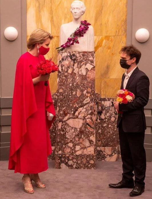 Queen Mathilde wore a red fuchsia silk gown from spring summer 2020 collection of Natan. Queen Elisabeth Piano Competition 2021