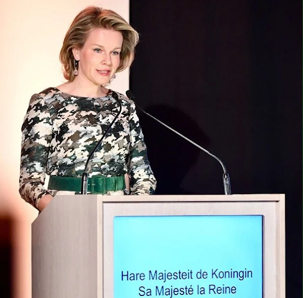 Queen Mathilde gave a speech about financial education and the sustainable development goals at the NYSE Euronext Brussels Stock Exchange in Brussels. Queen wore natan dress