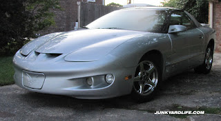 Shiny chrome 5-spoke wheels and shiny silver paint.