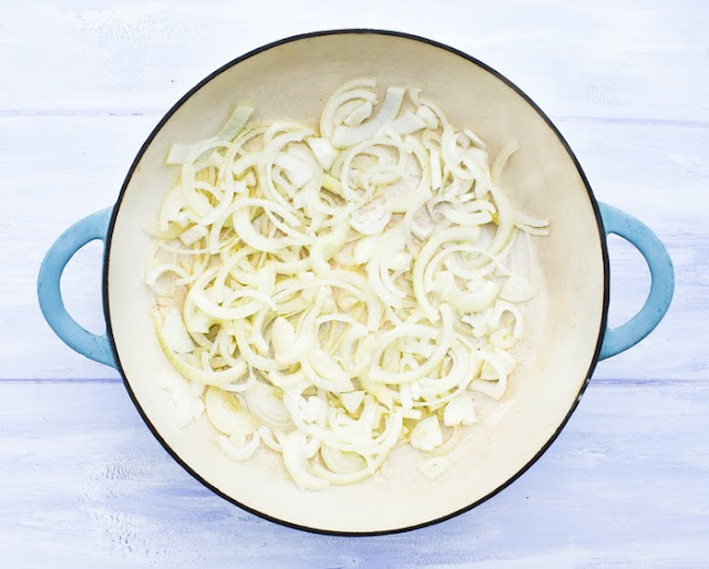 Mushroom Stew Step 1 - Onions (sliced onions in a large casserole pan)