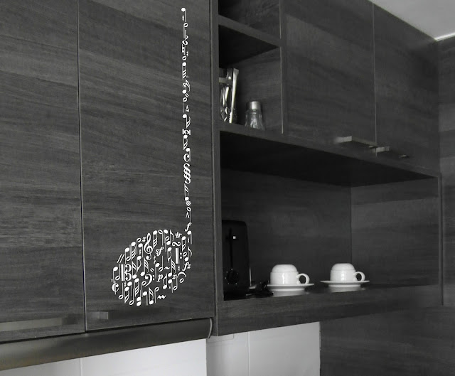 Note applied to a cupboard in a kitchen, the music design is made of lots of notes and symbols for any music lover that would want to decorate their home with wall art