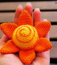 http://translate.google.es/translate?hl=es&sl=it&u=http://leartidiminerva.blogspot.com/2014/03/amigurumi-e-un-fiore-o-un-sole.html&prev=/search%3Fq%3Dhttp://leartidiminerva.blogspot.it/2014/03/amigurumi-e-un-fiore-o-un-sole.html%26safe%3Doff%26biw%3D1429%26bih%3D961