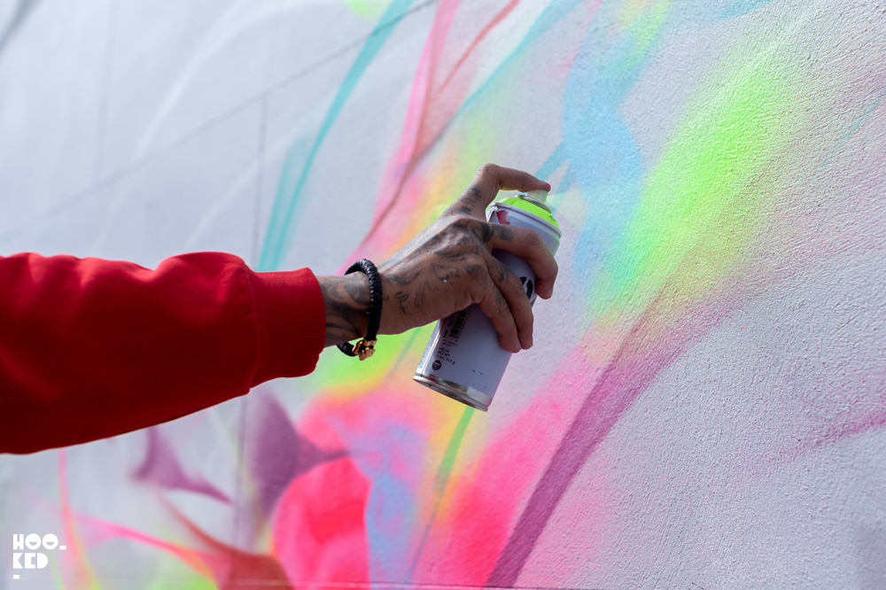 Brazilian street artists L7M at work on his mural in Cheltenham Brazilian street artists L7M at work on his mural in Cheltenham