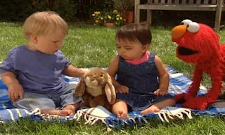 Elmo asks a baby how it takes turns and the two babies just played together with a stuffed bunny. Sesame Street Elmo's World Friends Kids and Baby