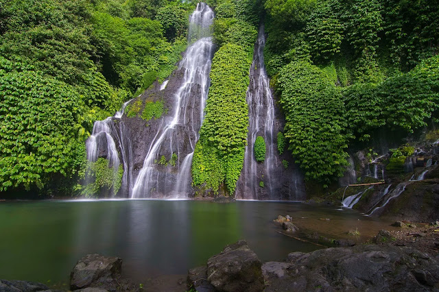 Discovering the hidden waterfall in the forest in Bali indonesia Discovering the hidden waterfall in the forest in Bali indonesia