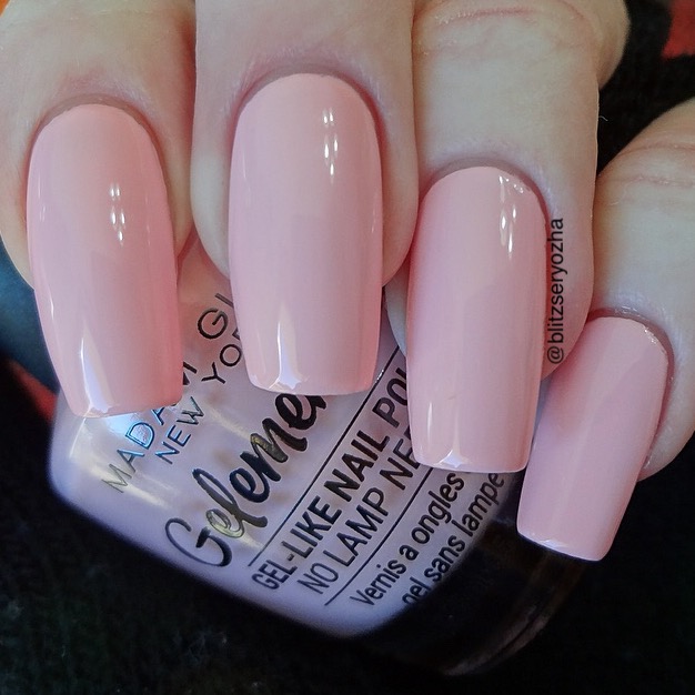 A swatch photo showing two coats of Madam Glam "Pop Quiz," a light pink creme polish