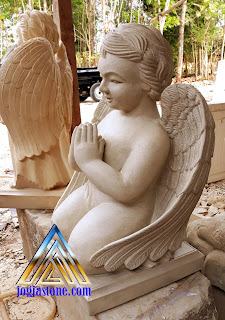 kerajinan seni patung terbuat dari batu alam putih kekuning-kuningan motif Patung Angel