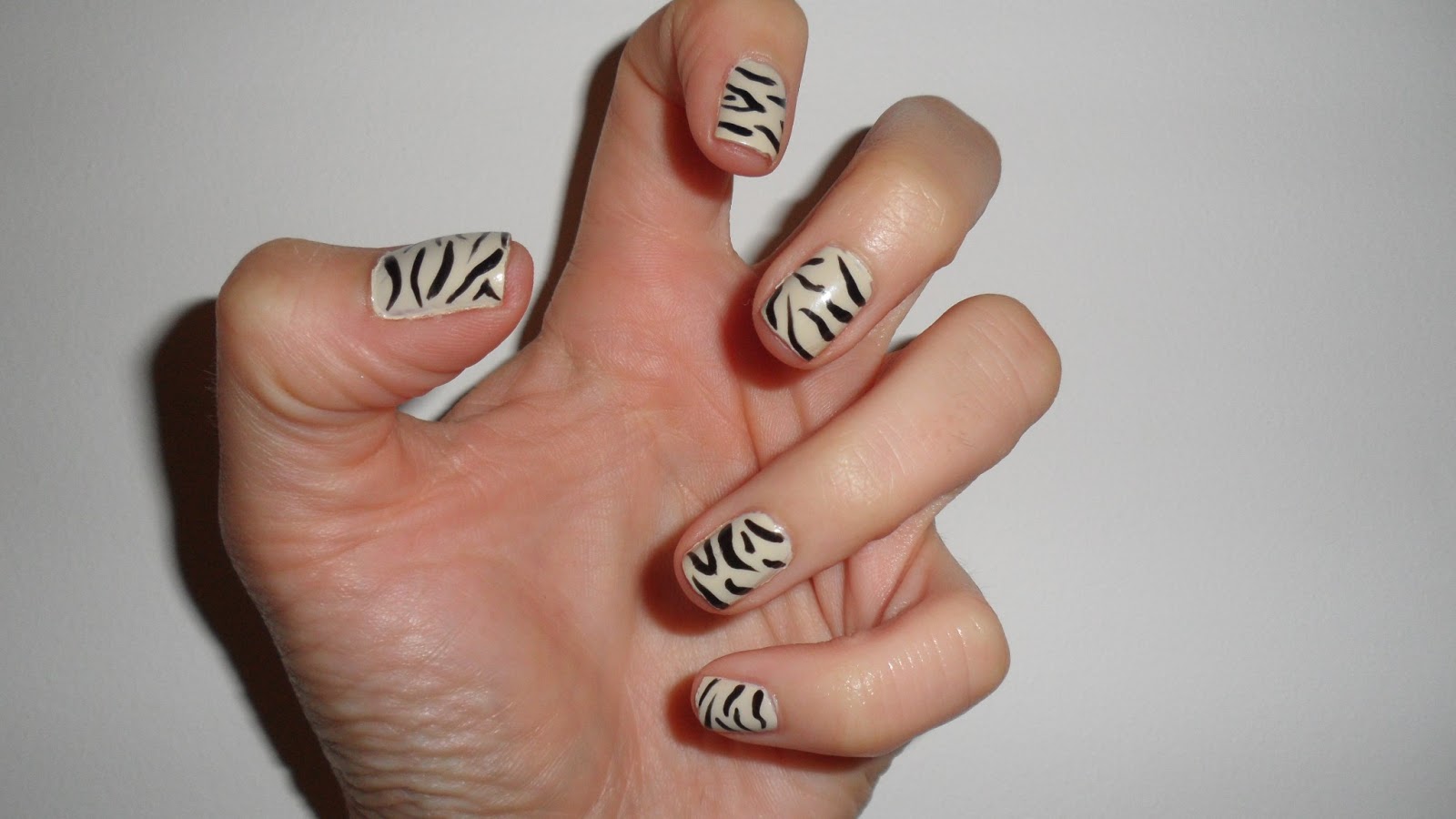 Zebra print nail art by Nailificent on SheSaidBeauty