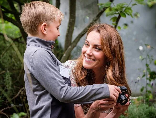 Kate Middleton is wearing a print floral summery midi dress, Castaner wedges and her Catherine Zoraida earrings