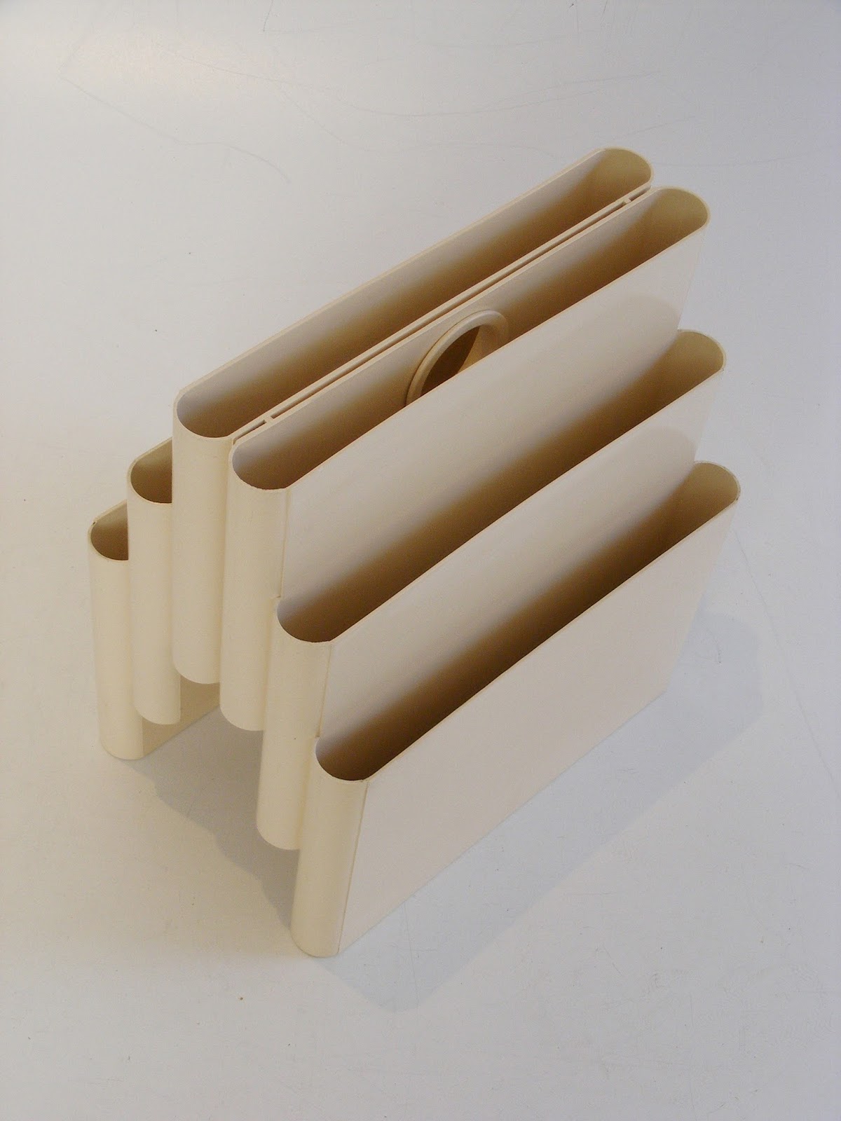 VAMP FURNITURE A vintage Kartell magazine holder designed by G