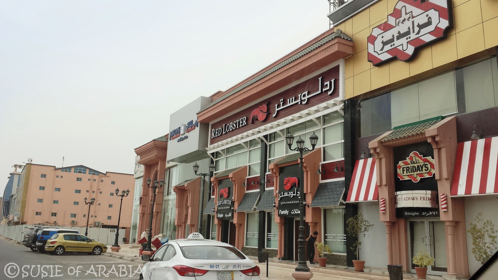 Jeddah Daily Photo Red Lobster and Friday's Logos in Arabic